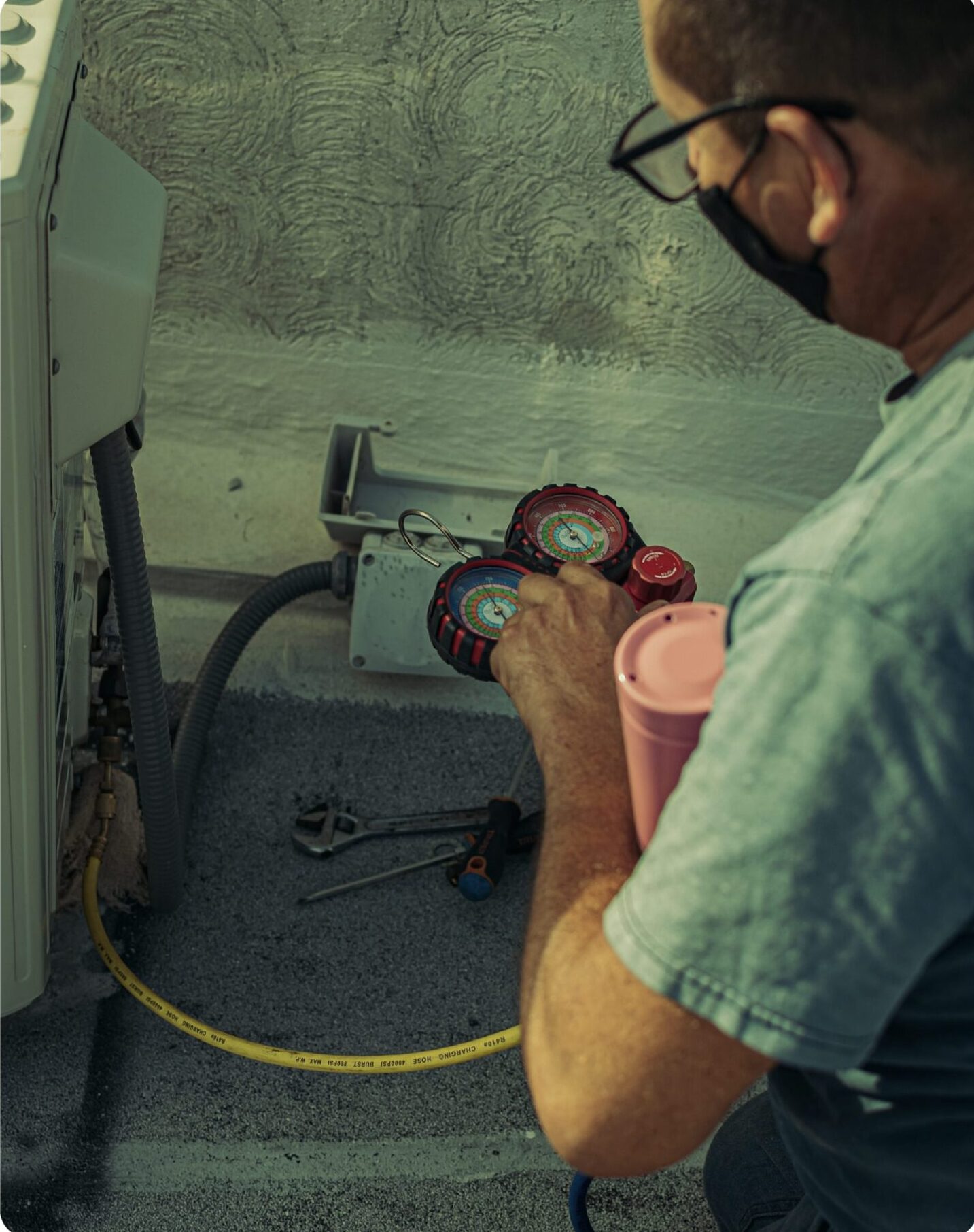 a technician repairing an HVAC unit